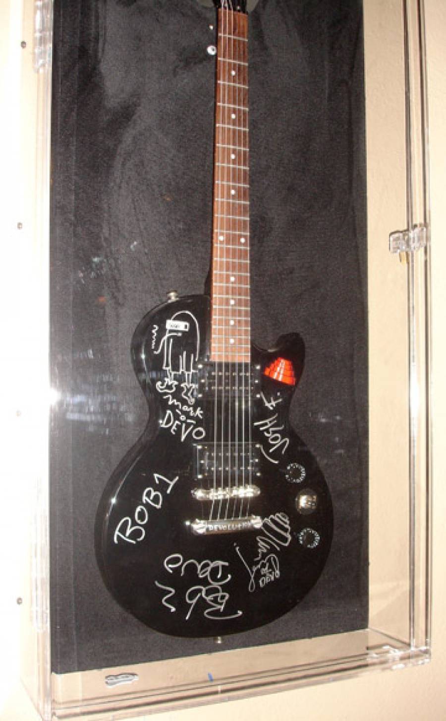11/3/09: Guitar Signed by DEVO